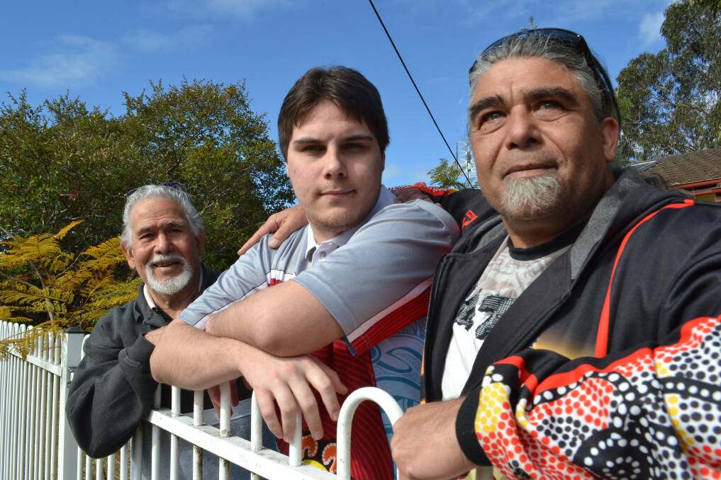 KICKING GOALS: Blake Groves with his proud grandfather Clive (left) and father Jason at the family home in Bomaderry on Wednesday. Picture: Rebecca Fist
