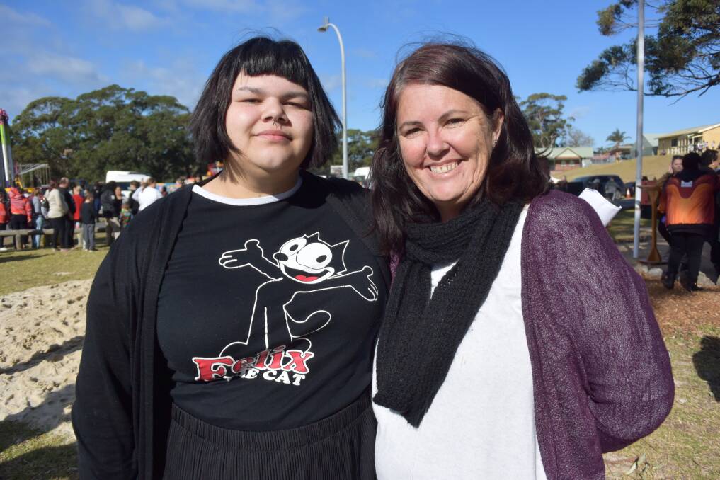 BRAVE: Vincentia High Year 12 student Tasma Ardler presented poetry about rascism, and her friend Gai Brown was among many in the crowd at Wreck Bay on Monday who were moved by her work. Picture: Rebecca Fist