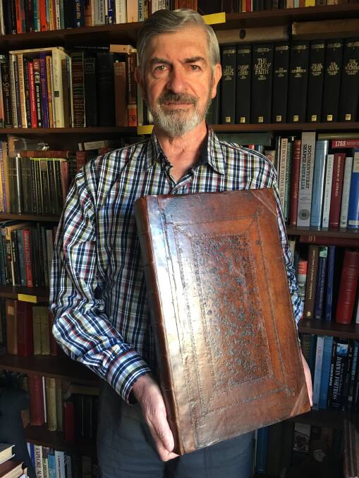 HISTORY TALK: Noel Merrick holding an original issue of Matthew Prior's Poems on Several Occasions' published in London in 1718 - exactly 300 years ago.