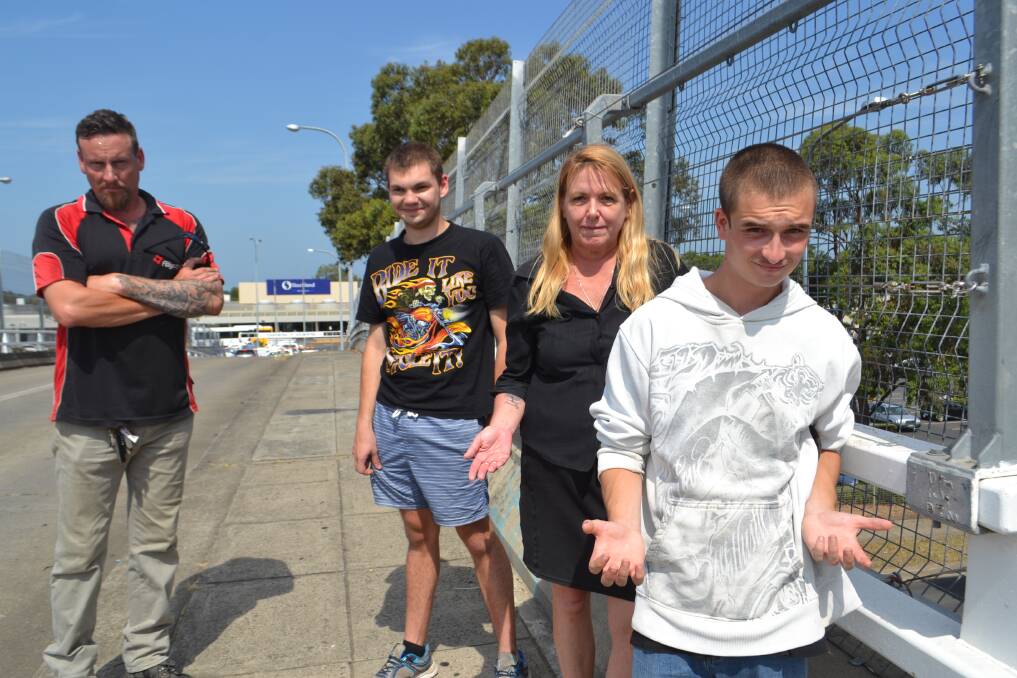 AT A LOSS: Flagstaff support workers Jono Donald and Cherie Fraser and program participants Sakari Middleton and Mark Sheaves at the bridge to Stockland, Nowra, on Tuesday. Picture: Rebecca Fist