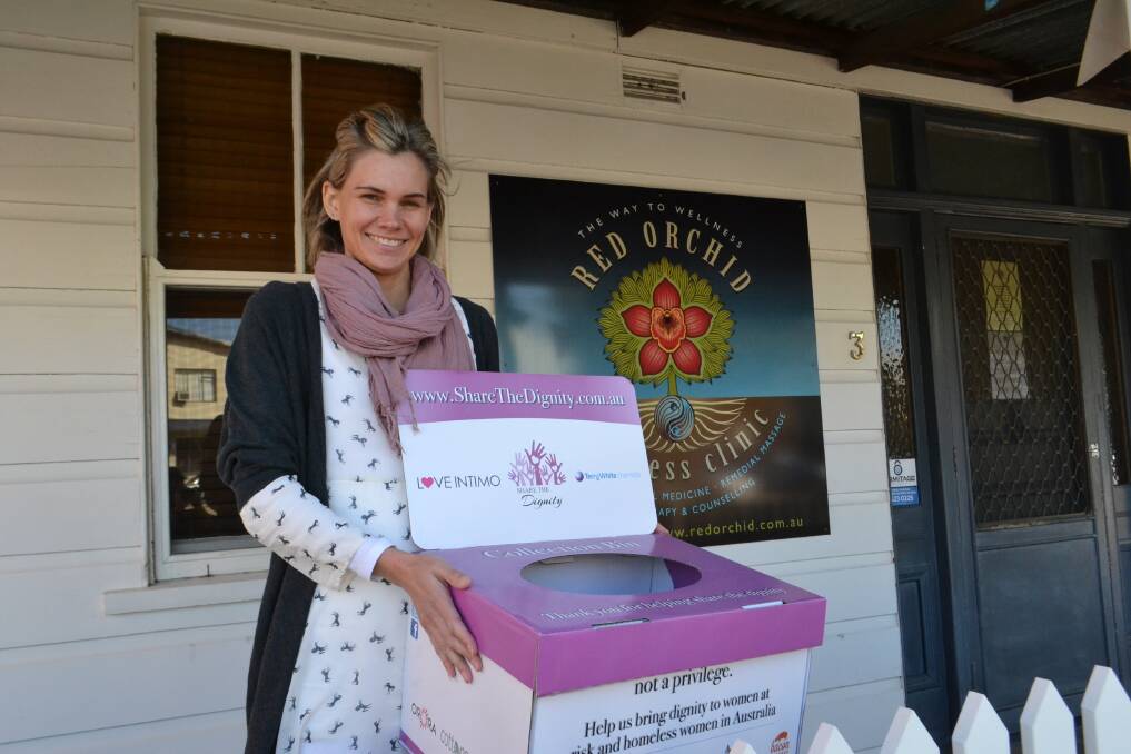 LOCAL DROP POINT: There are dropboxes across the Shoalhaven, including one at Red Orchid in Nowra's CBD. Gemma Thornton from Red Orchid is featured in this picture on Wednesday. Picture: Rebecca Fist