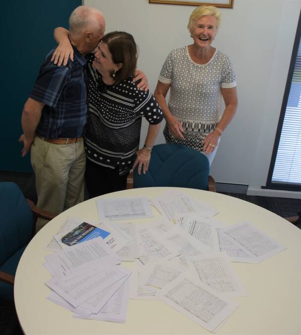 Vincentia Matter secretary (right) Liz Tooley and treasurer Bob Clark present the petitions, containing more than 5000 signatures to Shelley Hancock at her office in Nowra on Tuesday. Picture: Zoe Cartwright