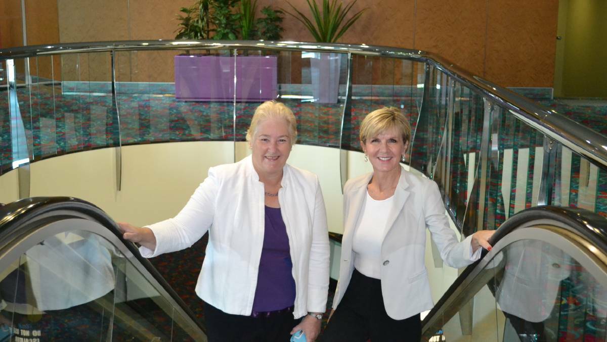FLASHBACK: Gilmore MP Ann Sudmalis and Foreign Minister Julie Bishop ride the Batemans Bay Soldiers Club escalator to a breakfast gathering before the federal election in 2016. Ms Bishop gave the gathering a ringing endorsement of Mrs Sudmalis.