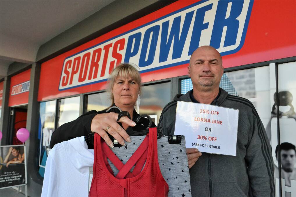 Sportspower Nowra owners George and Petra Kulcsar put Lorna Jane stock on sale to compete with the pop-up on Thursday. Picture: Rebecca Fist