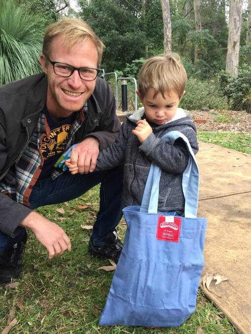 Justin Field and his son, Banjo, with a Boomerang Bag at the World Environment Day Fair in Huskisson in June.