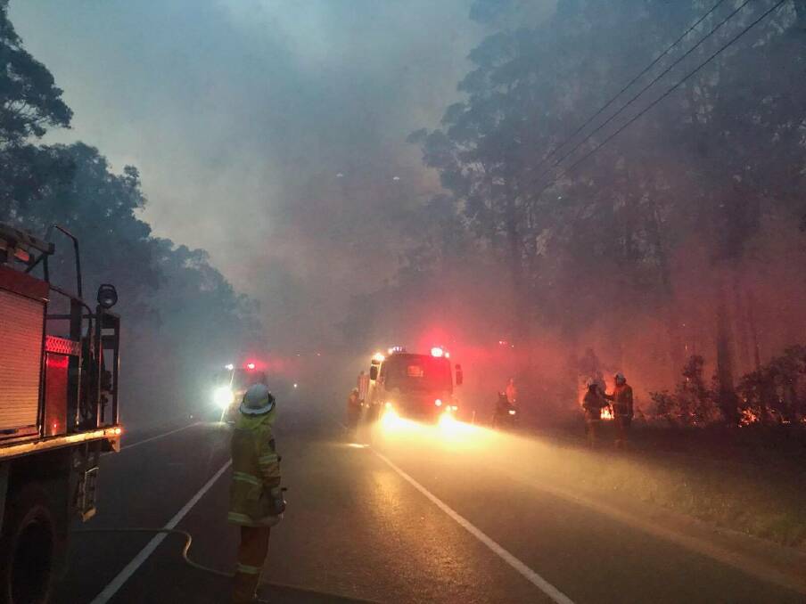 NSW Rural Fire Service crews work through the night to manage the St Georges Basin fire. Image from The Wool Road on Monday at about 10pm. Picture: Huskisson Volunteer Rural Fire Brigade
