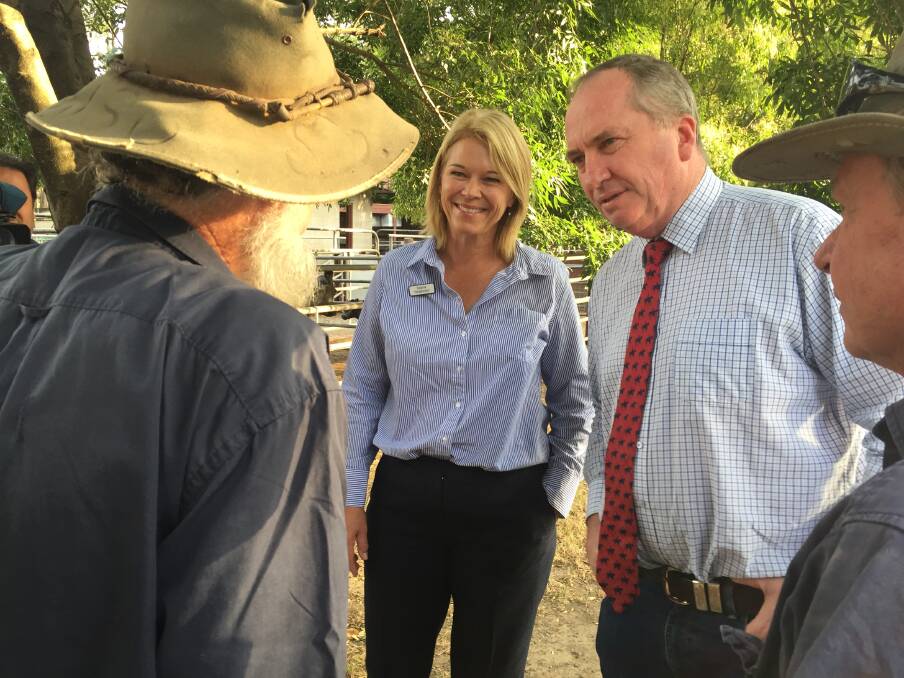 Katrina Hodgkinson and Barnaby Joyce meet with Shoalhaven farmers at the saleyards on Thursday. Picture: Rebecca Fist