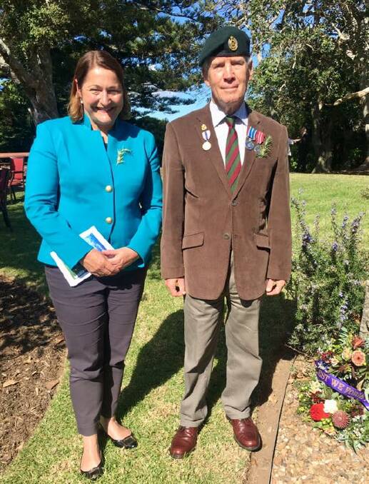Fiona Phillips with veteran and local resident John Akister laying a wreath at the Anzac Commemorative Service at Coastal Waters on April 17. 