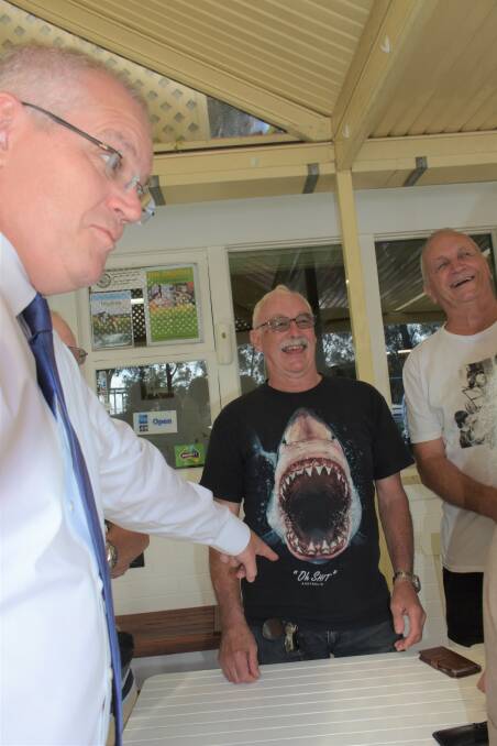 Scott Morrison has a laugh with retirees in Nowra on Friday. "This is the face of Labor's [franking] tax policy." Picture: Rebecca Fist