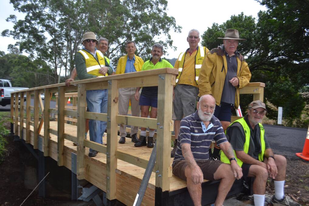 Cambewarra Residents and Ratepayers Association volunteers, who helped to build and put the bridge in place, the final piece of the pathway on Tuesday. Picture: Rebecca Fist