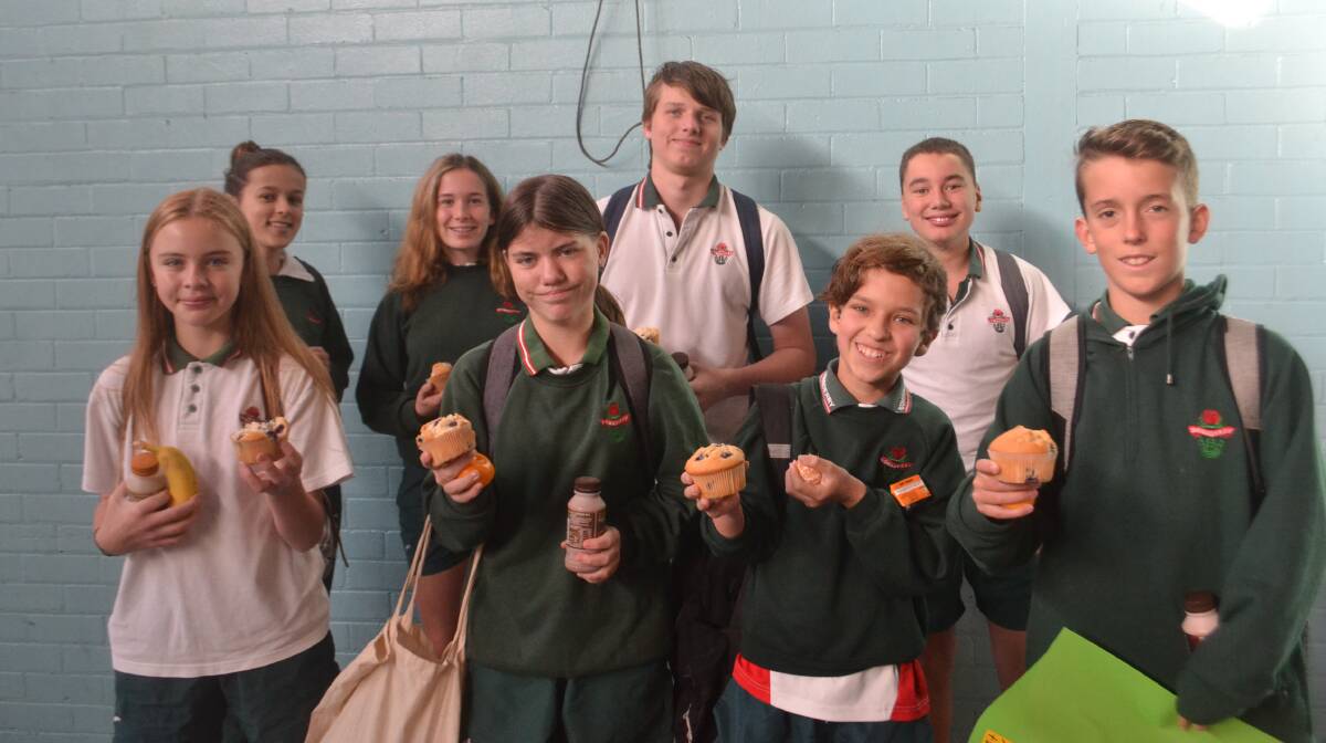 FREE BREAKY TO GO: Bomaderry High School kids Chloe Marney, Year 7, Akala Miller, Year 7, Dino Dicembre, Year 7, Noah Goodsell, Year 7, (back) Cedar Podmore, Year 9, Rosie Whittaker, Year 9, Caleb Smith, Year 9 and Jasper Dunn, Year 9 on Tuesday morning. Picture: Rebecca Fist