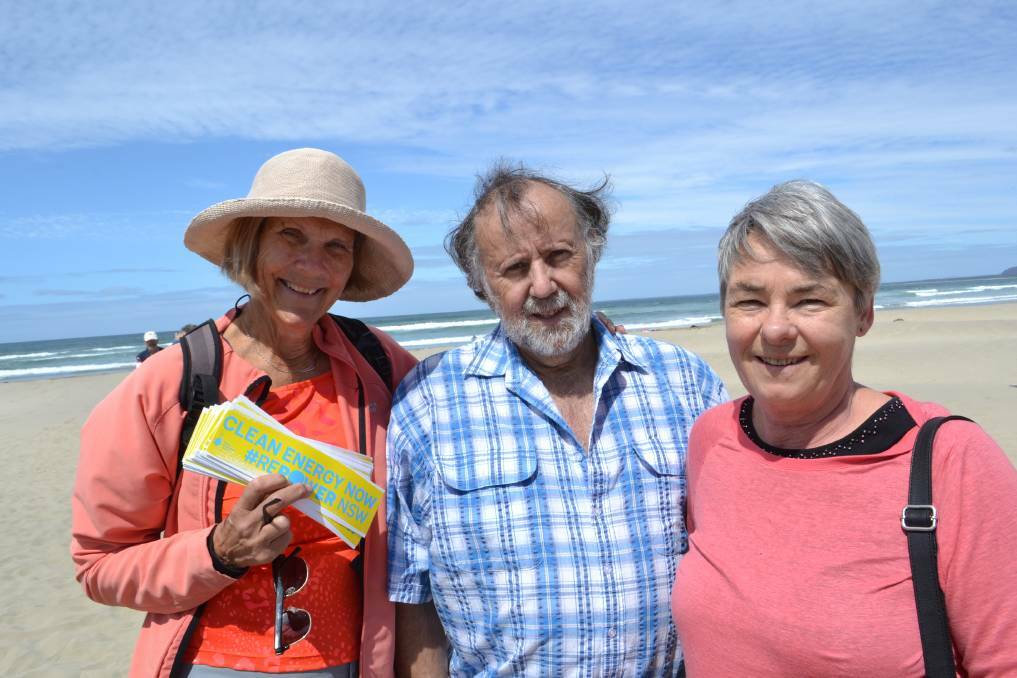 Susan Griffiths from Gerroa, Peter Meaney from Kiama and Kiama councillor Kathy Rice joining the Stop Adani rally to form a human sign on Seven Mile Beach in 2017.