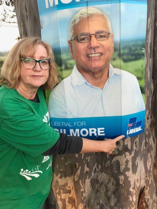 NOT IMPRESSED: Greens Candidate for Gilmore raises awareness about Warren Mundine's signs along Moss Vale Road, Cambewarra.