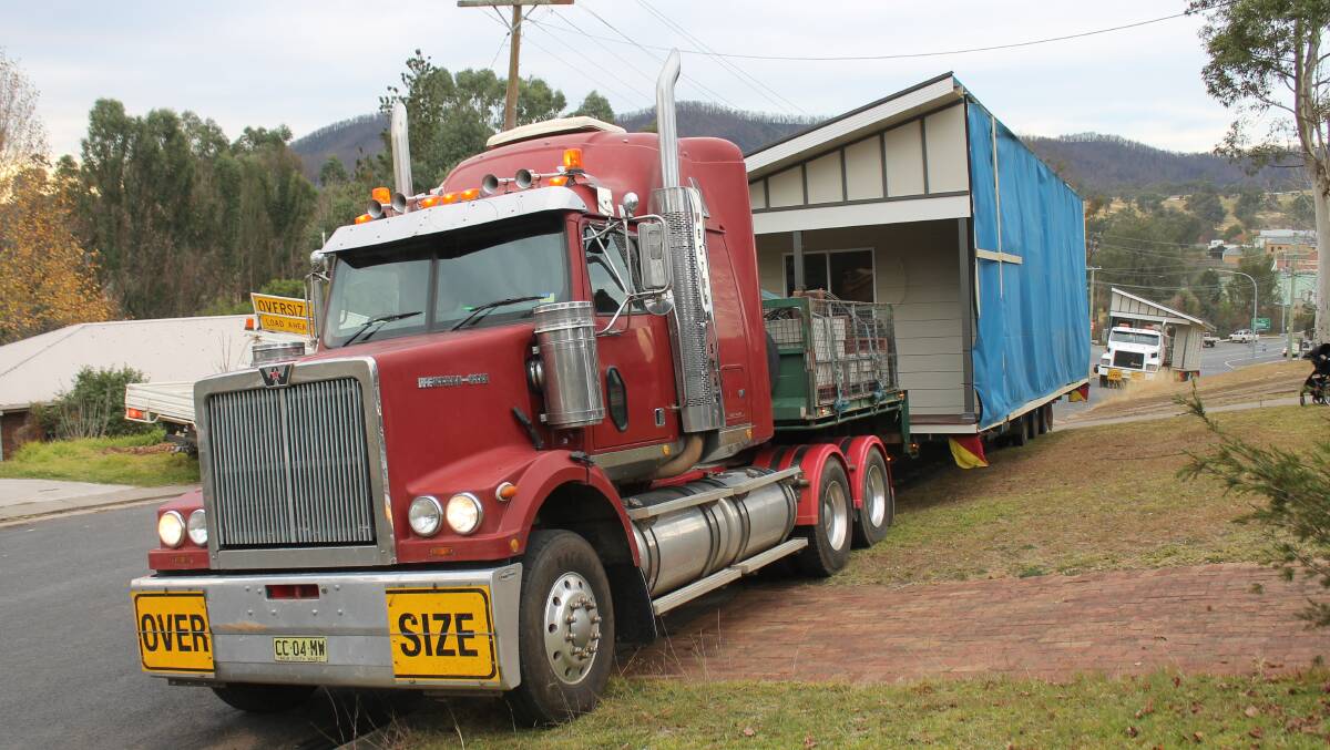 The two halves of the house, which were paid for by Ron's insurance, arrive on Tuesday. 