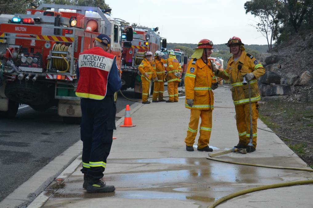 Fire fighters on the scene of a fire at Burrill Lake in September 2017.