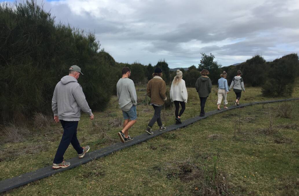 Walkers explore the Murramurang Aboriginal Area track in Bawley Point. Photo: Emily Barton. 