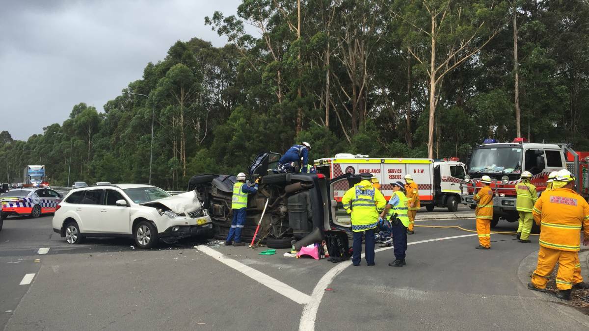 Emergency services attend a two car collision on the Princes Highway at the Island Point Road intersection in 2016. The NSW Government has allocated funding to upgrade the highway south of Nowra, including the Island Point Road intersection. 