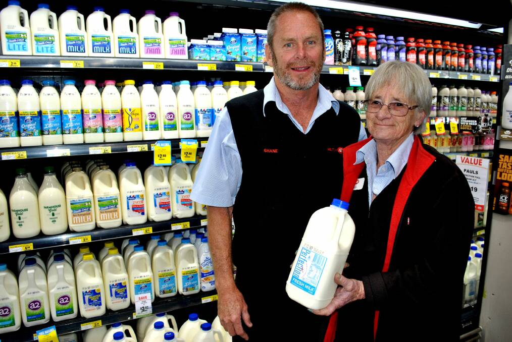 MILK PRICE: Milton IGA co-owner Shane Wilson and dairy manager Rita Shead with the Perfection 2 litre milk, which is now sold for the increased price of $2.19 in an effort to benefit local farmers. Photo: Emily Barton. 