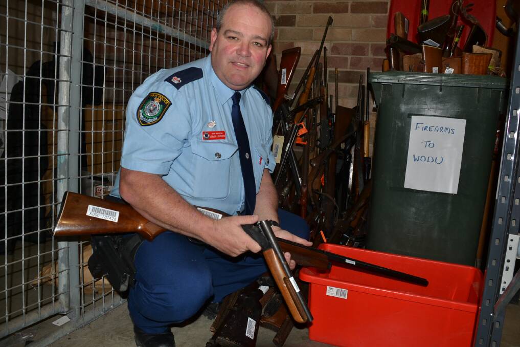 Shoalhaven Local Area Command Chief Inspector Steve Johnson with some of the guns surrendered locally during the gun amnesty.