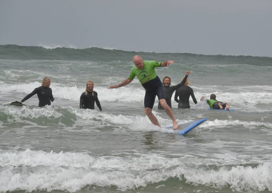 YES: Greg Ross catches a wave in the Veterans Surfing Program much to everyone's delight.