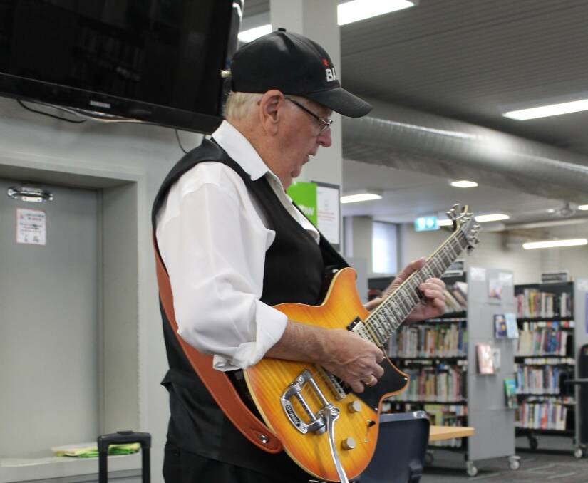 READY TO GO: Local musician Barry Jennings during one of his performances at the Nowra Library. Image Supplied