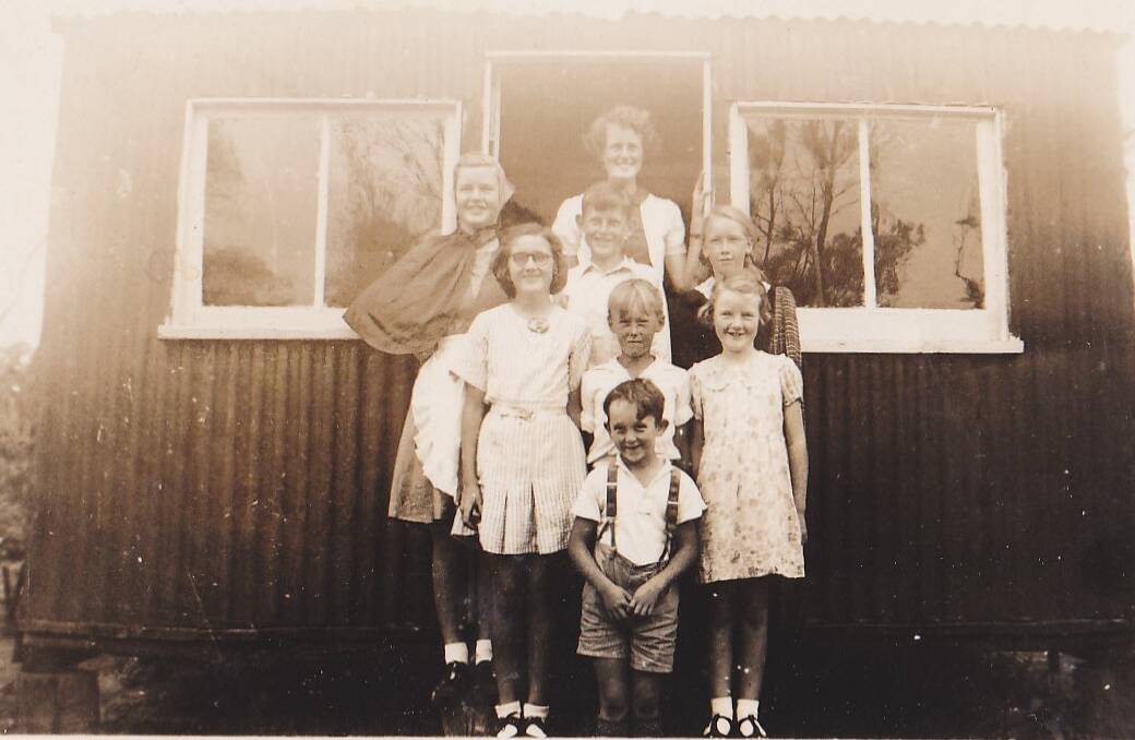 The late Joan Lamond, the school teacher, with students at Currarong in the 1940s.