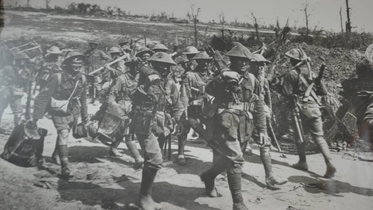 Bob Brown's father, Sergeant Horace Brown (front) carries a machine gun out of Pozières with the 2/19 Machine Gun Battalion in 1916.