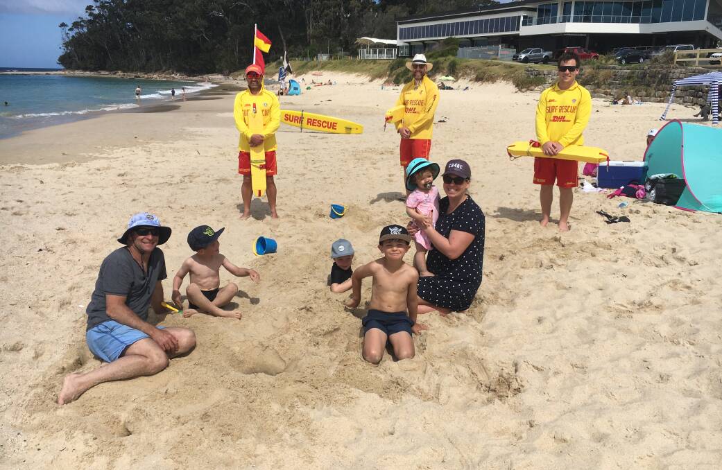 ON PATROL: Canberra family Arran and Kayleigh Blazic with their four children enjoying the safety of Mollymook Beach with Mollymook Surf Lifesaving Club members who were on patrol. Photo David Johnson
