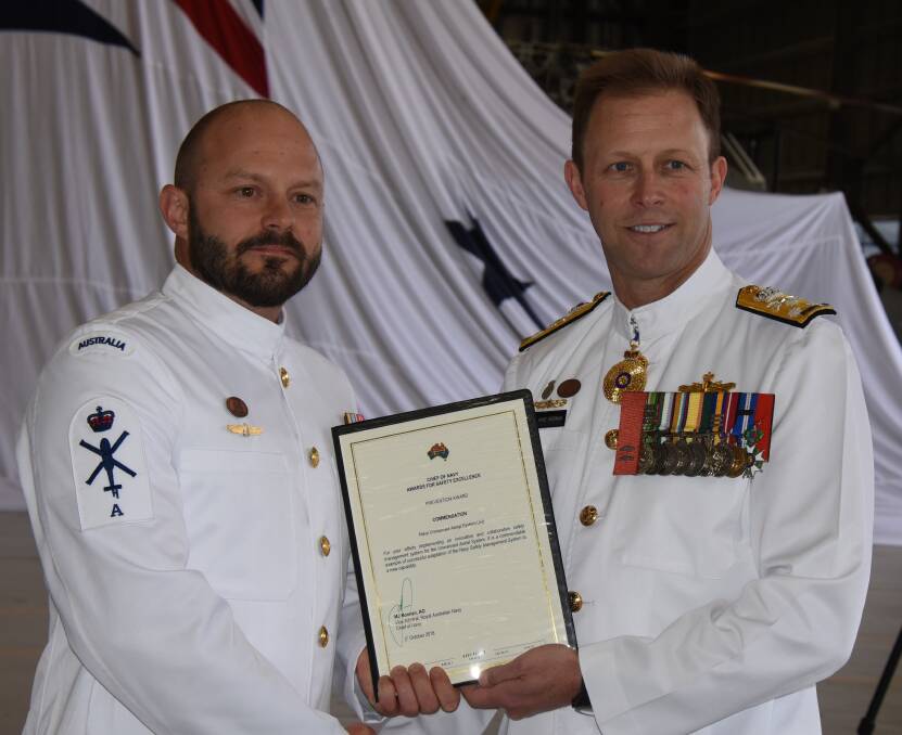  
Chief of Navy Vice Admiral Michael Noonan presents 822X Squadron, Petty Officer Peter O’Sullivan with a Navy Safety Award.
