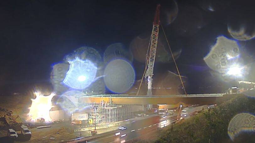 SPECIAL EFFECTS: The rain on Wednesday night made for some special effects on Anna Glynn's photo as the girders for the Strongs Road overpass as part of the Berry to Bomaderry Princes Highway upgrade were put in place. I