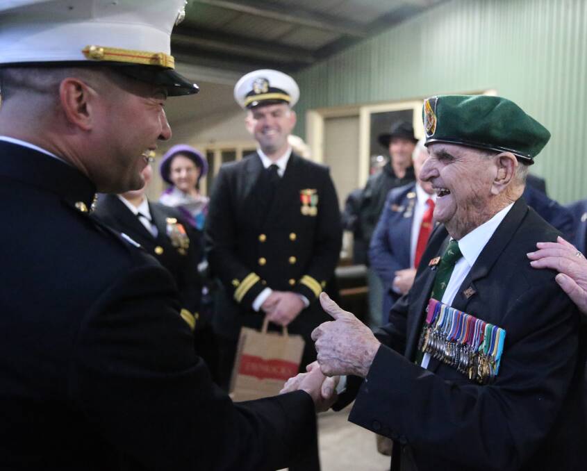 GREAT TIME: US Embassy Defence Marine Attaché, Captain David Rivera shares a lighter moment with Australia's oldest surviving Victoria Cross recipient, Keith Payne.
