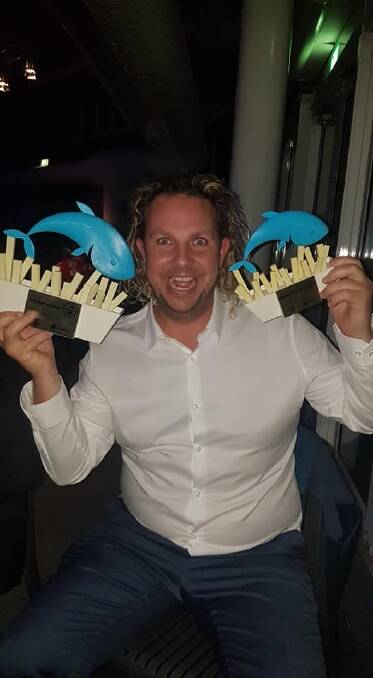 Greenwell Point Pelican Rocks Cafe's Sam Cardow celebrates double success at the NSW best fish and chips awards in Sydney.
