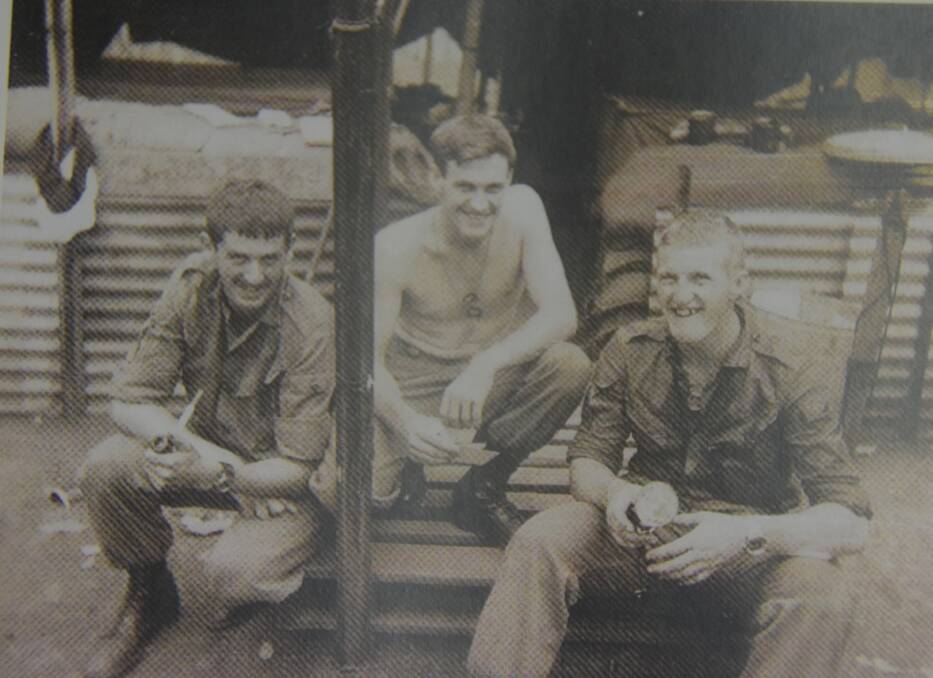 Nowra's Barry Brown (centre) with John Plowman and Bob Porter outside their tent in Vietnam.