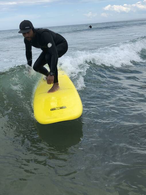 RIDE: Andy Singh on a wave during the Veteran Surf Project.