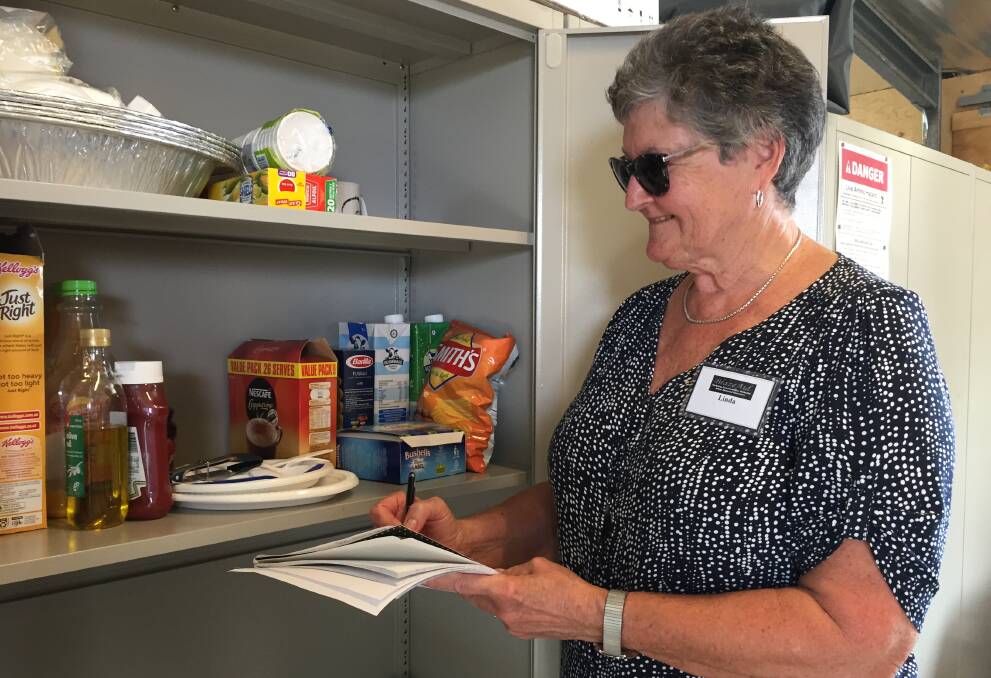 MENU: Linda Bice planning the next meal for the Kangaroo Valley BlazeAid volunteers. Photo: Robert Crawford
