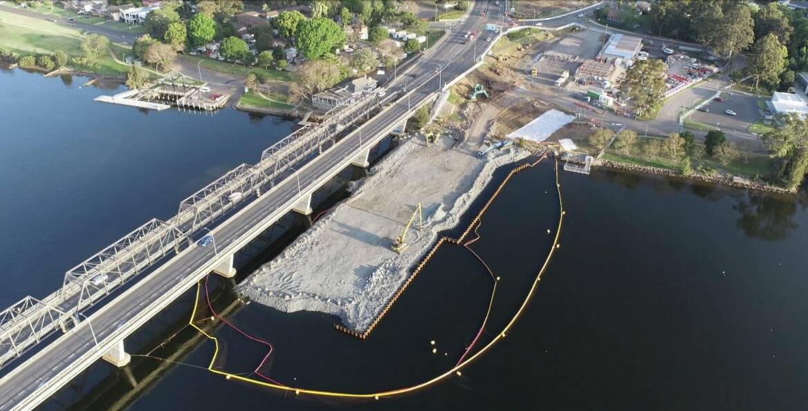 IMPRESSIVE: The temporary rock platform on the southern side of the river has been completed. Affectionately nicknamed Fulton Hogan Island the platform provdes a working area for bridge piling and foundation work in the southern half of the river, where the water is shallow. Image Transport for NSW