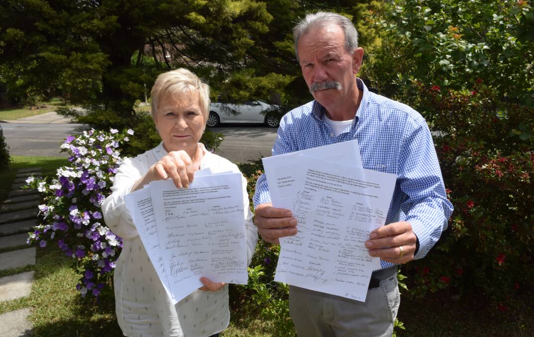 FIGHT: Berry residents Tina Ballard and Nic Delfos with the letter to be sent to Premier Gladys Berejiklian signed by 64 residents affected by the noise from the bypass. Photo: Hayley Warden