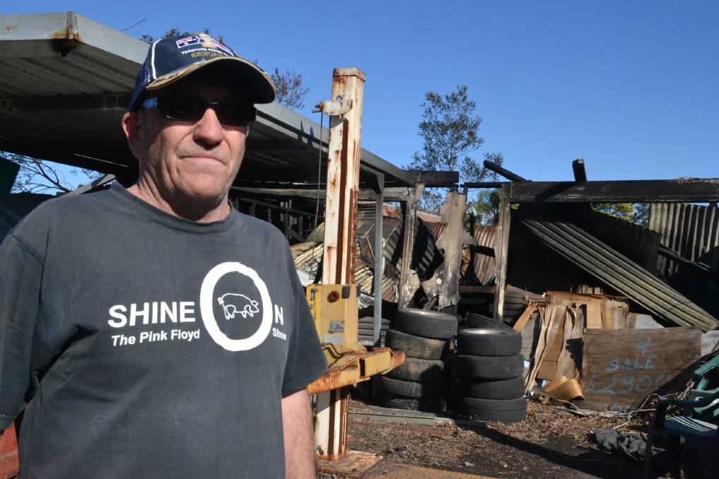 Bomaderry man Ned Ashley surveys the damage of the shed destroyed at Bomaderry in the West Cambewarra Road fire. Photo: Robert Crawford