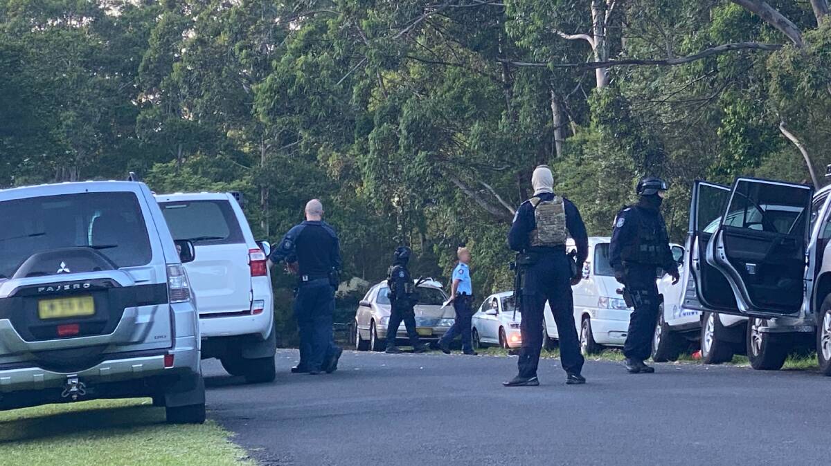 RAID: The NSW Joint Counter Terrorism Team converge on the quiet village of Tapitallee, west of North Nowra early Friday morning. Photo: John Hanscombe.