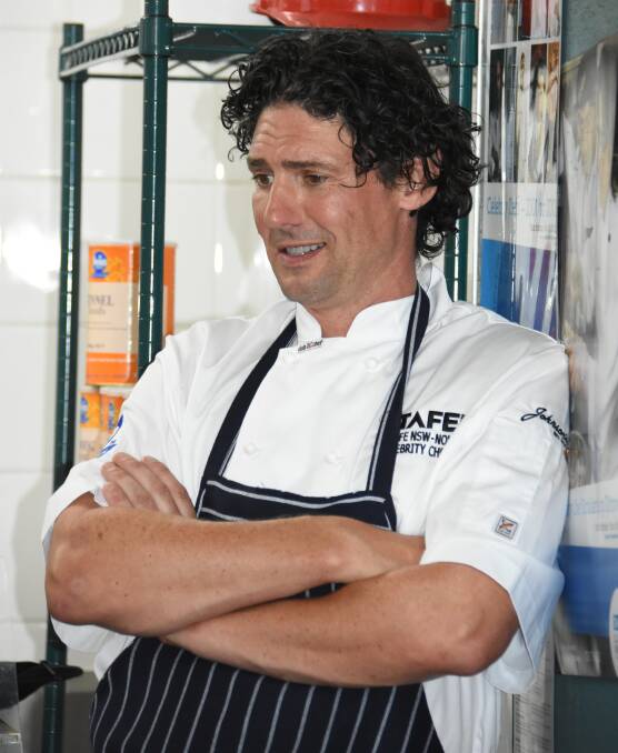 Celebrity chef Colin Fassnidge oversees service in the kitchen.
