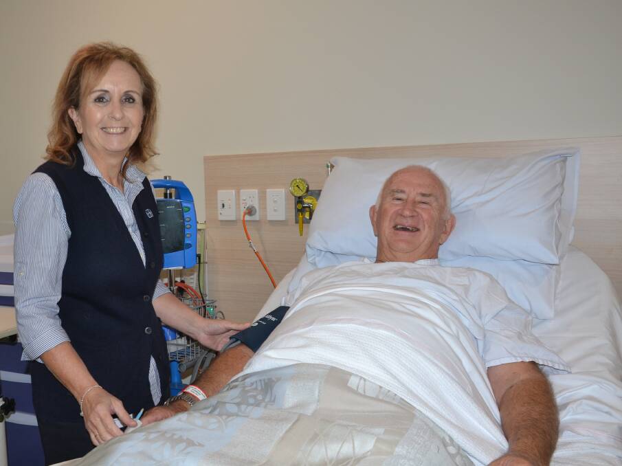 FIRST: Nowra Private Hospital's new ongology centre Nurse Unit Manager Sonia Smith with their first patient, Tomakin man Colin Moylan.