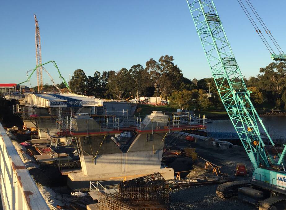 MASSIVE WORK The new $342 million Nowra bridge continues to take shape with three of 19 bridge deck segments now in place.

