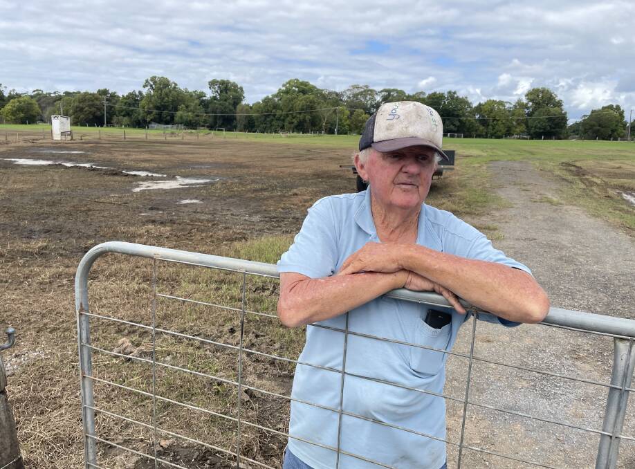 WHAT A MESS: The big wet that hit the Shoahaven two weeks ago and more follow up rain at the weekend has led to Own Ison having to postpone this year's Terara Country Music Campout. Mr Ison is standing at a gate leading to the area where caravans park for the campout, that was underwater during the recent floods.