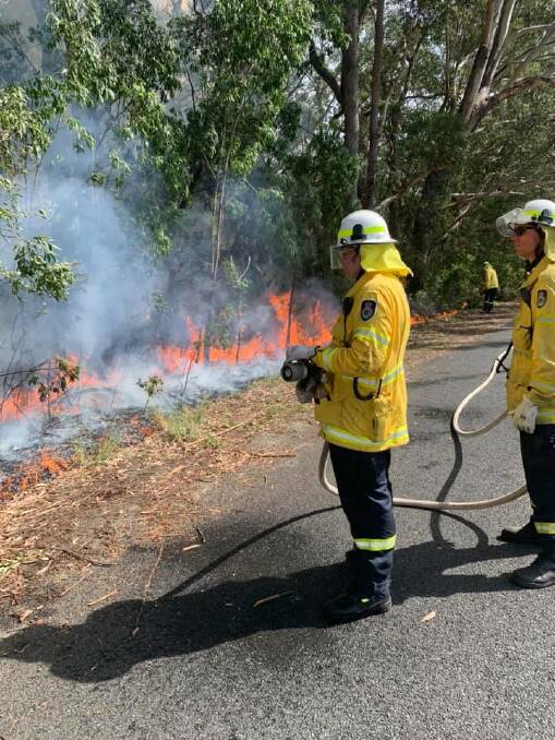 WATCHFUL: Rural Fire Service crews monitor the progress of Tuesday's hazard reduction burn at Huskisson on Tuesday, Photo: Basin View RFS