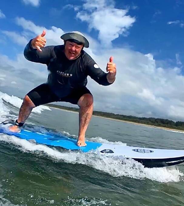 HAVING FUN: Fred Campbell couldn't hide his enthusiasm as he caught a wave as part of Veteran Surf Project.