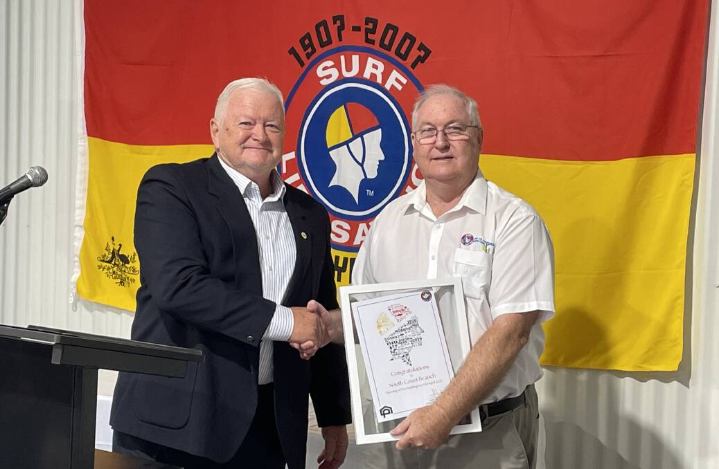 HONOUR: Henry Scruton, of behalf of the Hunter Surf Life Saving, made a special presentation to South Coast president Steve Jones to mark the official opening of the South Coast Branch Training, Administration and Storage Centre.