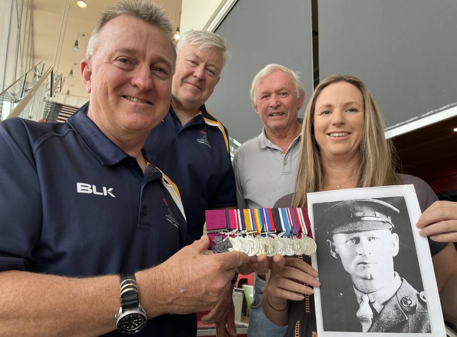 PRESENTATION: Keith Payne VC Veteran Benefit Group chairman Rick Meehan and vice-chairman Fred Campbell present a replica set of Reginald Judson VC medals to his great grandson Neil Lord and his daughter Janine.
