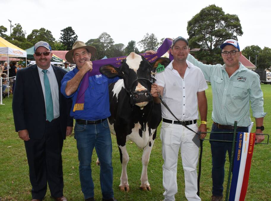 TOP OF THE LINE: Supreme champion cow, taking out the FA McIntosh Memorial Trophy, was the Walsh and Duncan Holstein entry of Juleanwes Windy Dita shown by Justin Walsh with judge Mark Patullo and Rob McIntosh.