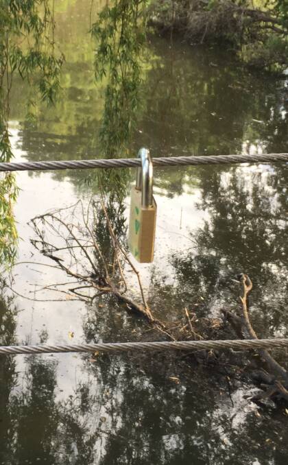 THE FIRST: Is this padlock on one of the bridges in Harry Sawkins Park, Nowra the start of a local love locks location?