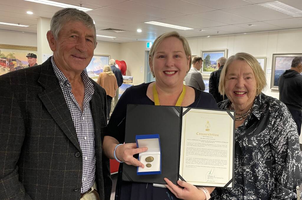 PROUD MOMENT: Collections curator of the Royal Australian Navy Fleet Air Arm Museum and Royal Australian Naval College Museum at HMAS Creswell, Ailsa Chittick with her proud parents Garth and Gail.